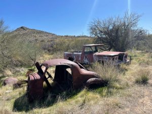 photo of rusty abandoned cars at harmony hollow