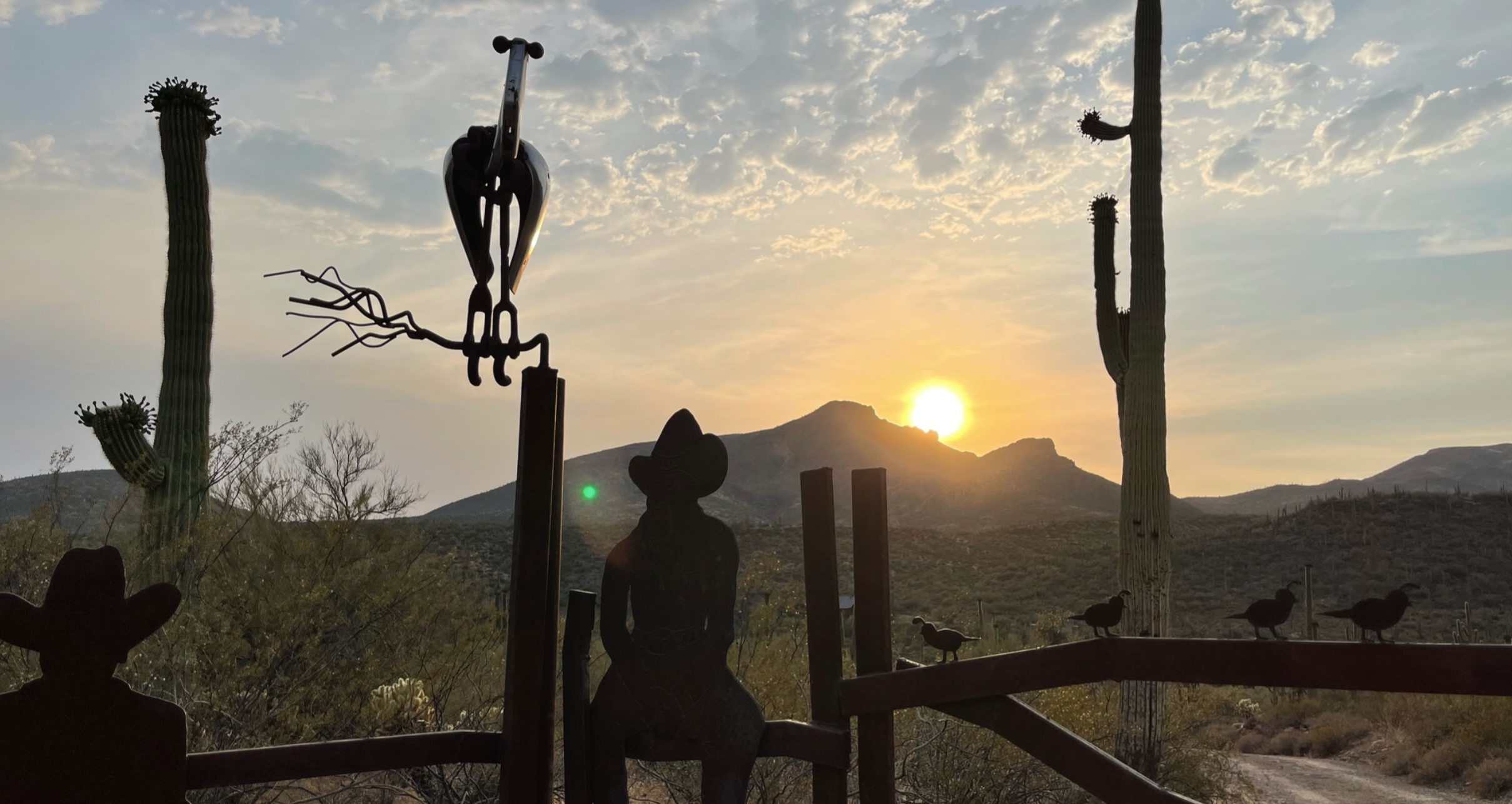 Harmony Hollow Cowboy Gate at Sunset