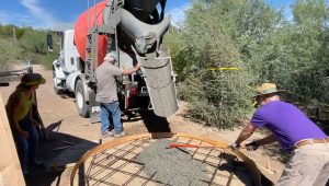 pouring cement for the water tank pad at harmony hollow