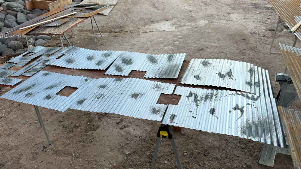 image of beginning process of rusting corrugated metal panes for kitchen wall