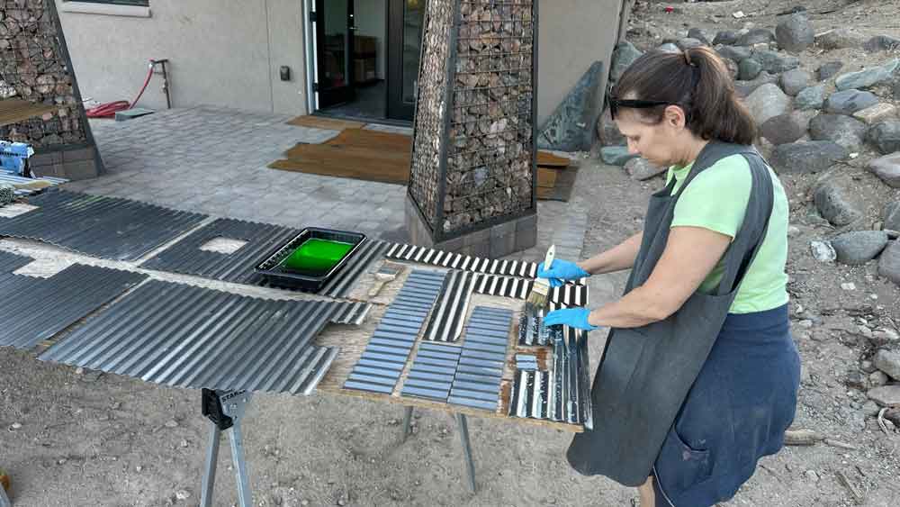 image of cleaning the corrugated panels before patina